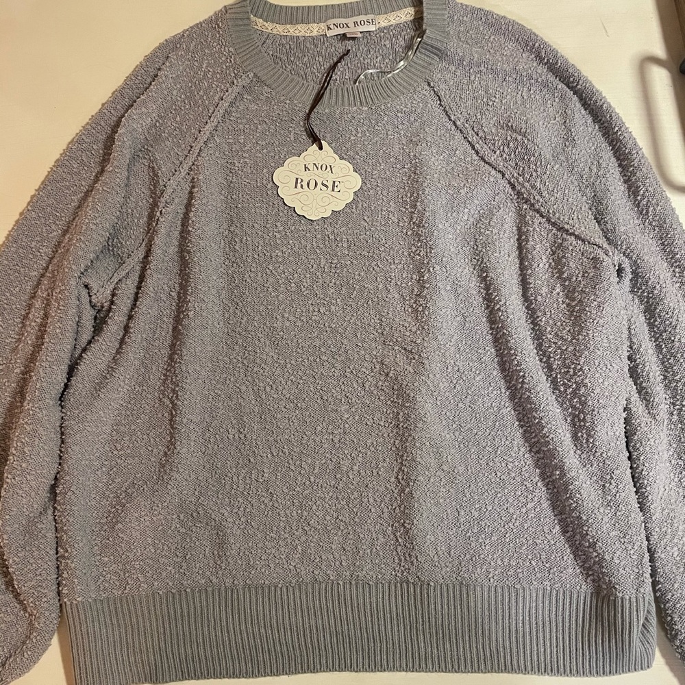 Long sleeved, gray sweatshirt